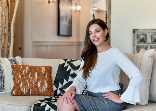 Patrice Peterson relaxing in a staged living room